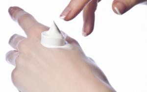 Sunscreen lotion on the back of hand.