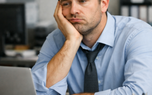 Bored man at workplace.